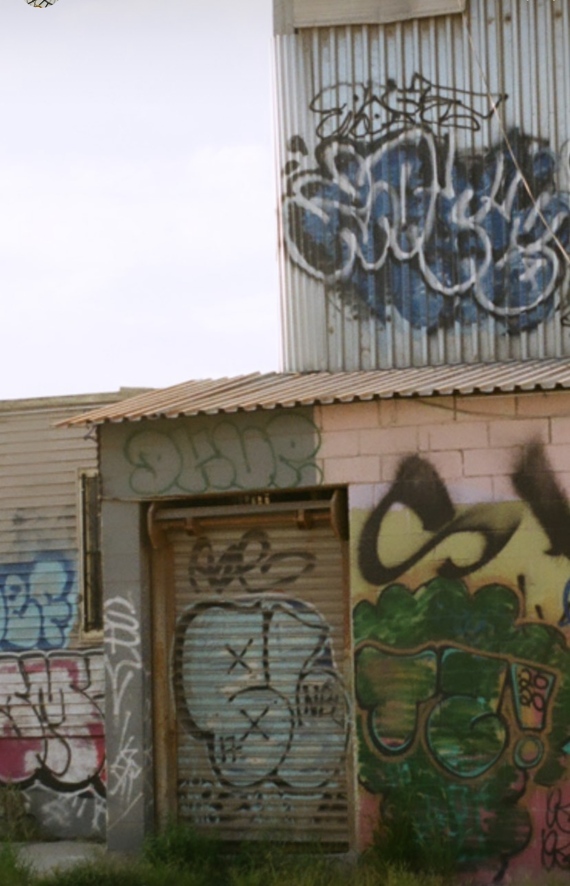 City's Edge: Graffiti and Green Awnings